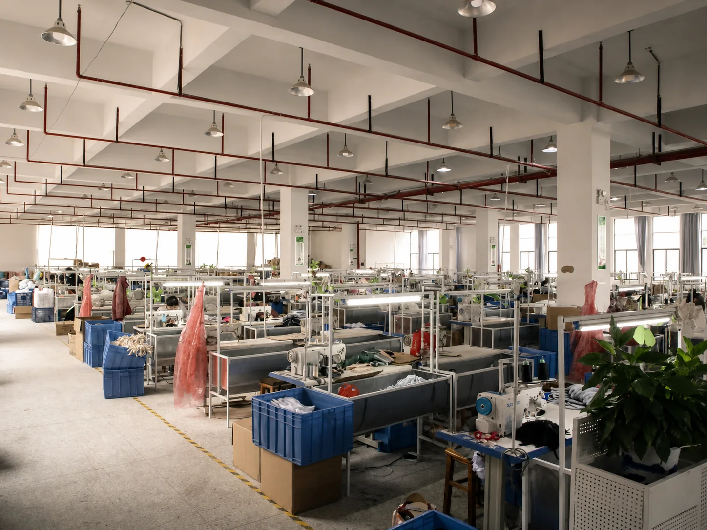 Active sewing workshop with production stations and workers
